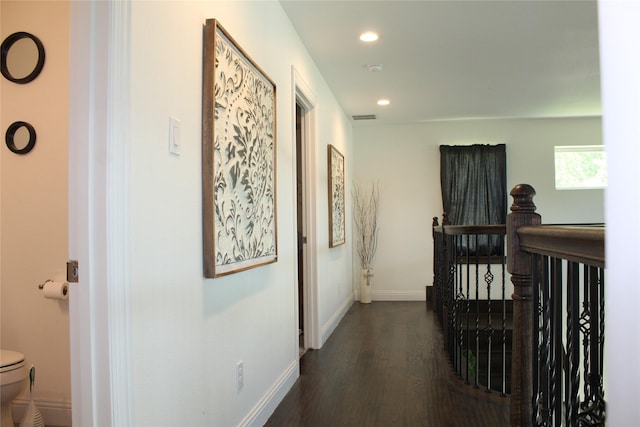 corridor with dark hardwood / wood-style floors