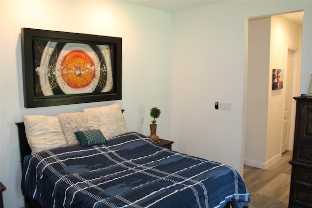 bedroom featuring wood-type flooring