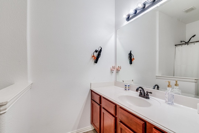 bathroom with vanity with extensive cabinet space