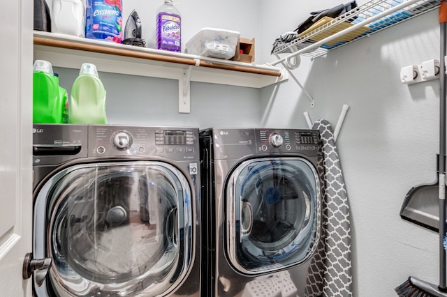 clothes washing area featuring washer and dryer