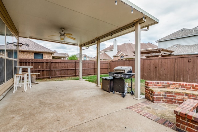 view of terrace featuring ceiling fan and area for grilling