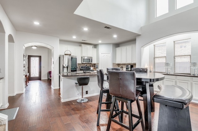 dining space with dark hardwood / wood-style floors