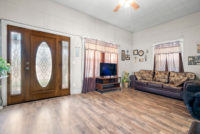 interior space with ceiling fan and hardwood / wood-style floors