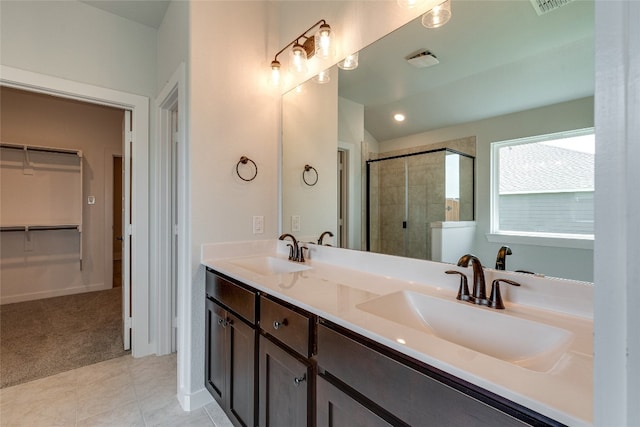 bathroom featuring an enclosed shower, tile floors, double sink, and large vanity