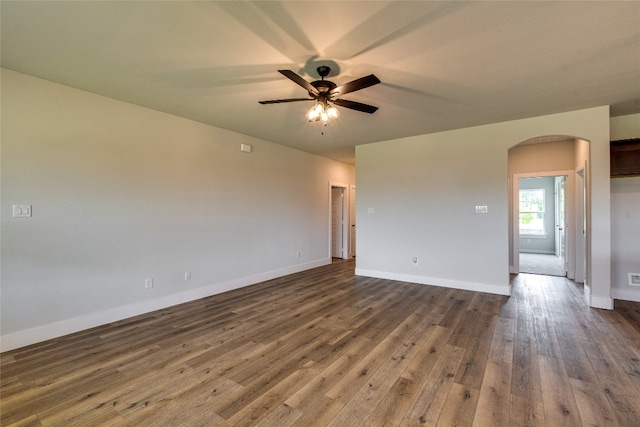 unfurnished room featuring ceiling fan and dark hardwood / wood-style flooring