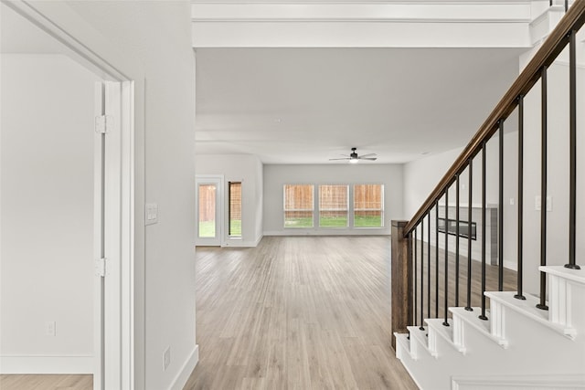 foyer featuring ceiling fan and light wood-type flooring