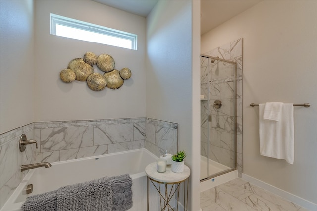 bathroom featuring tile floors and separate shower and tub