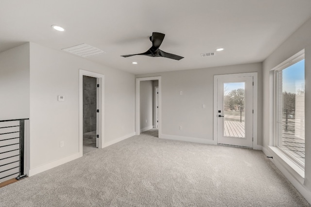 unfurnished living room with light carpet and ceiling fan