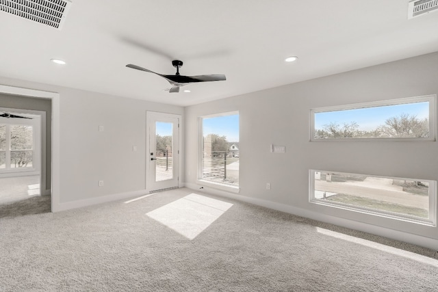 empty room with carpet floors and ceiling fan