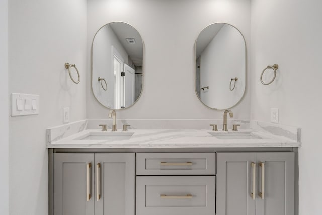 bathroom featuring dual vanity