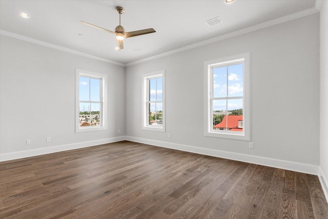 unfurnished room featuring dark hardwood / wood-style flooring, a wealth of natural light, crown molding, and ceiling fan