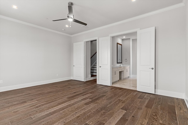 unfurnished bedroom with dark hardwood / wood-style floors, ceiling fan, crown molding, and ensuite bathroom