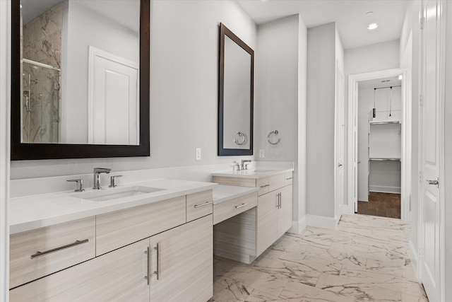 bathroom with vanity and a shower with door