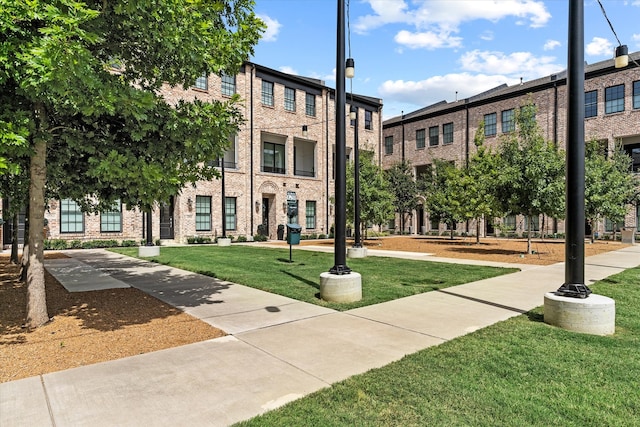 surrounding community featuring a lawn