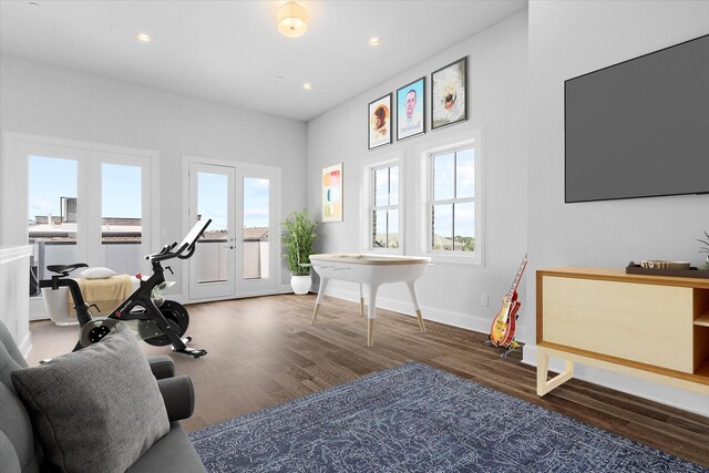 living room featuring ceiling fan, dark hardwood / wood-style flooring, and ornamental molding