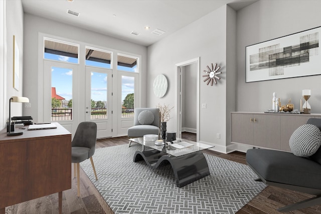 home office with dark hardwood / wood-style flooring