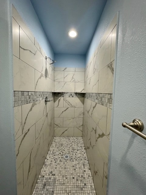 bathroom with tiled shower