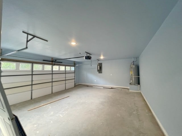 garage featuring a garage door opener and water heater