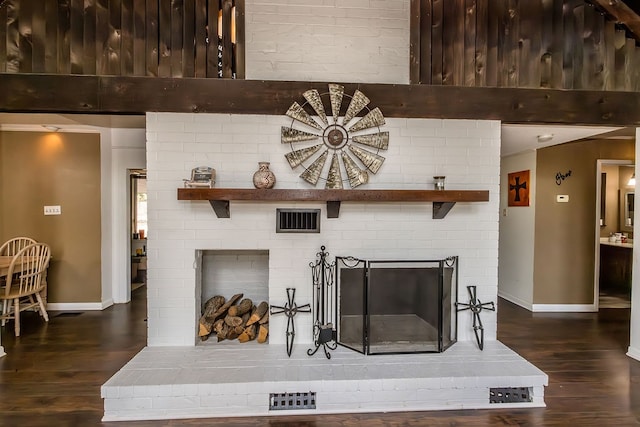 interior details featuring wood-type flooring and a fireplace