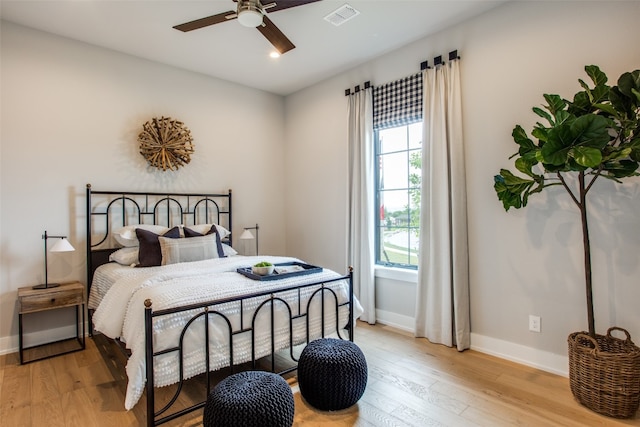 bedroom featuring ceiling fan and light hardwood / wood-style flooring