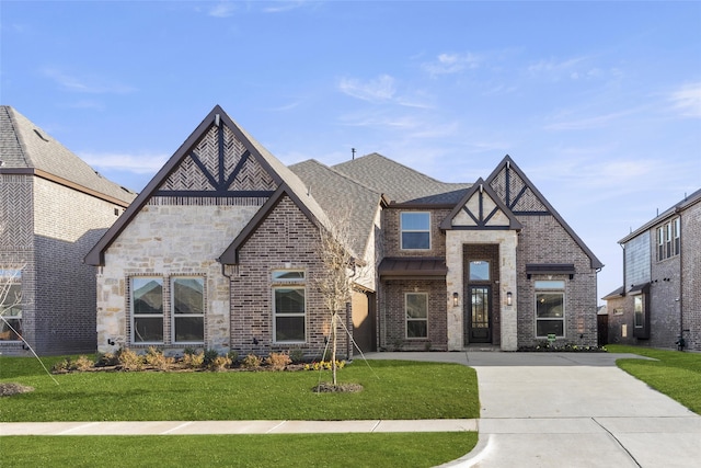 tudor home with a front lawn