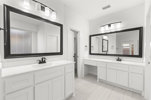 bathroom with vanity and tile patterned floors