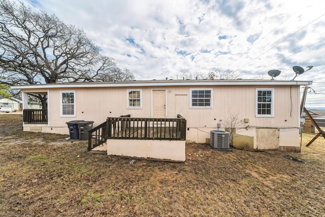 back of property featuring central AC unit