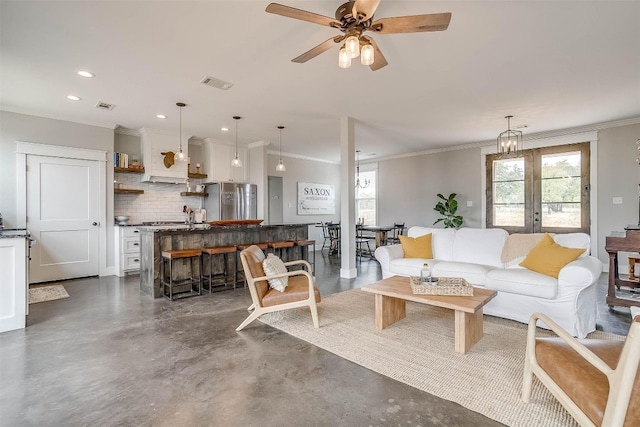 living room featuring ceiling fan, ornamental molding, and french doors