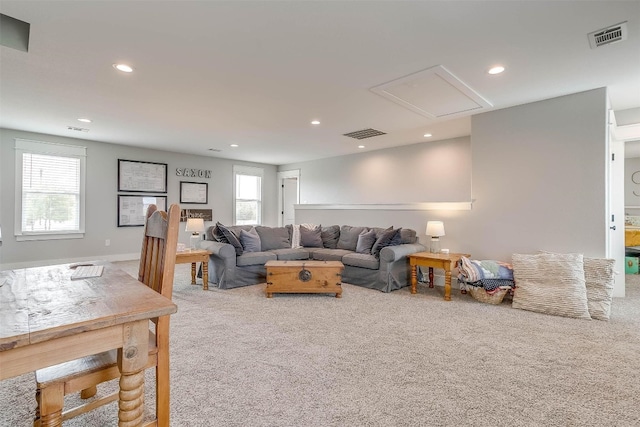 carpeted living room featuring a wealth of natural light