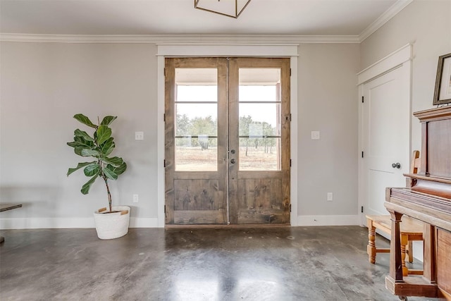 entryway with french doors, concrete floors, and ornamental molding