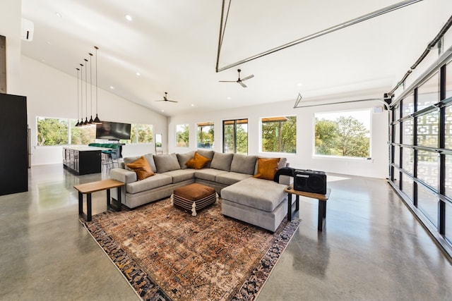 living room featuring ceiling fan and vaulted ceiling