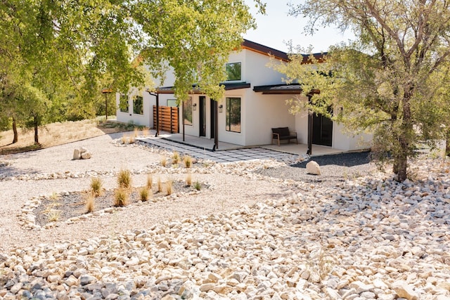 rear view of property with a patio area