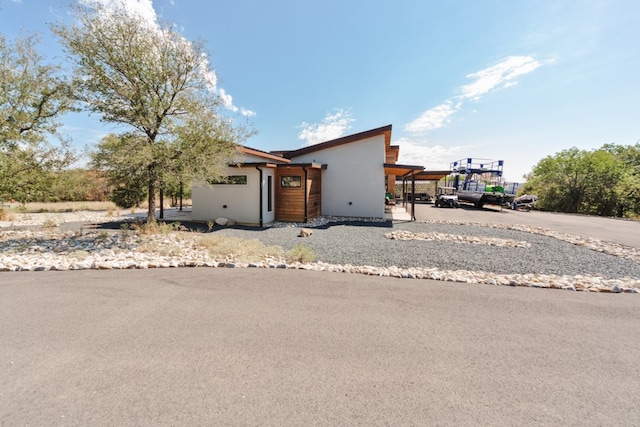 view of front of home featuring a carport