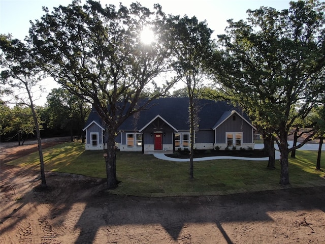 ranch-style home with a front yard