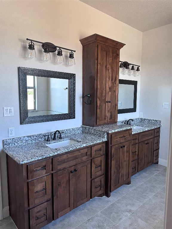 bathroom with vanity and tile patterned flooring