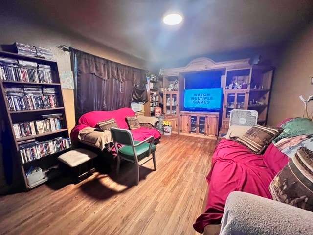 rec room with light hardwood / wood-style flooring