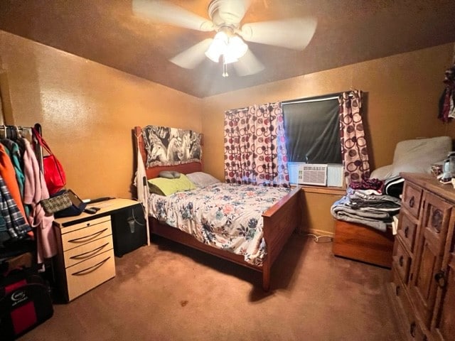 bedroom featuring dark carpet and ceiling fan