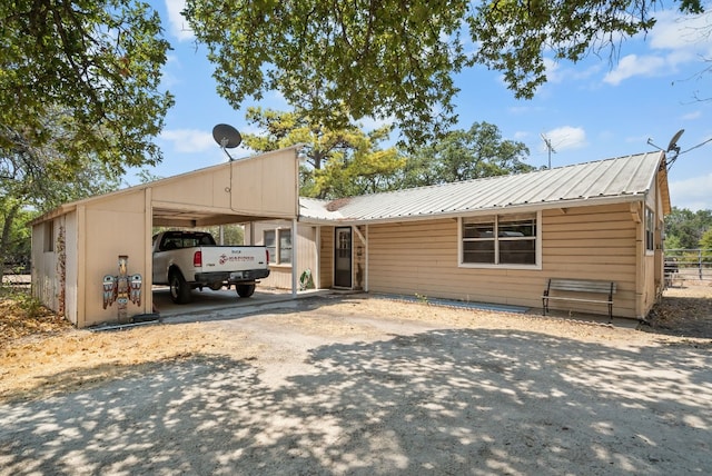 view of front of home featuring a carport