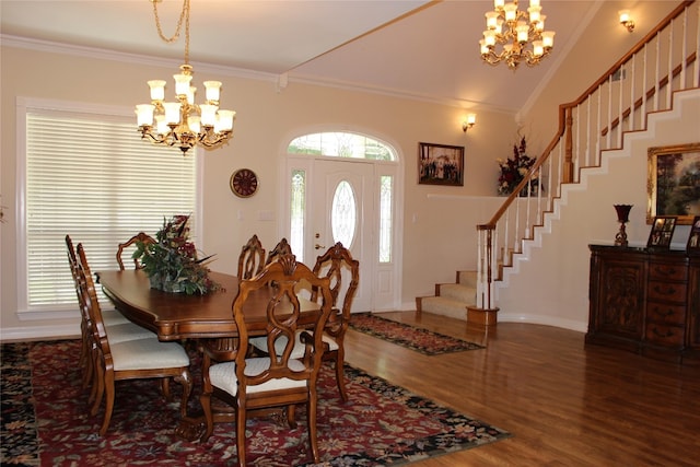 dining area with crown molding, dark hardwood / wood-style floors, and an inviting chandelier