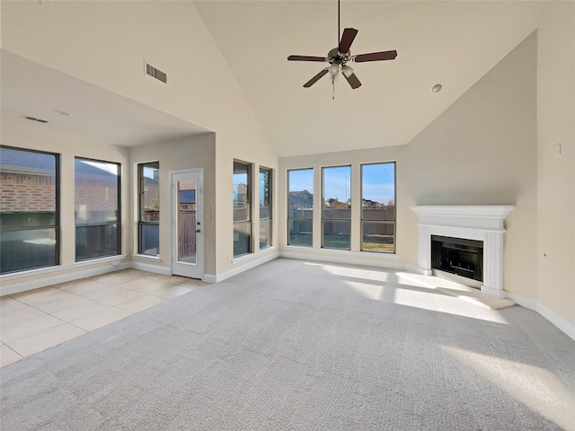 unfurnished living room featuring ceiling fan, light colored carpet, and high vaulted ceiling