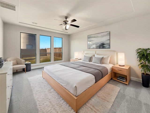 bedroom featuring light carpet and ceiling fan