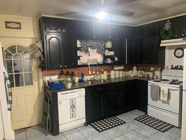 kitchen with exhaust hood, white appliances, sink, and light tile floors