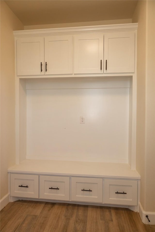 mudroom with baseboards and wood finished floors
