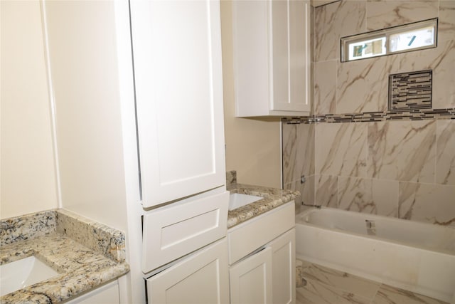 full bathroom with marble finish floor, bathtub / shower combination, and vanity