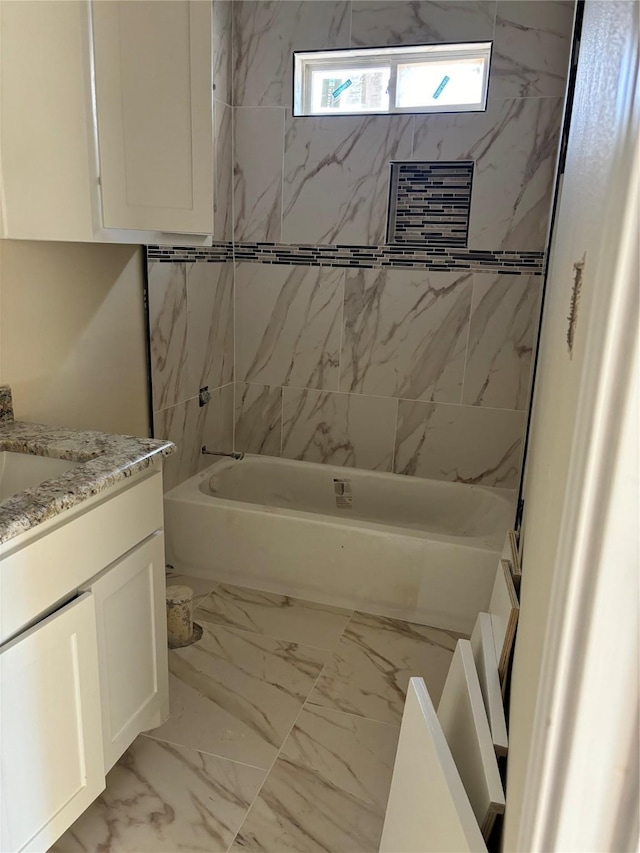 full bath featuring shower / bathing tub combination, vanity, and marble finish floor