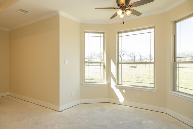 empty room with ornamental molding, visible vents, ceiling fan, and baseboards
