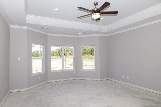 empty room featuring a raised ceiling, visible vents, baseboards, and unfinished concrete floors