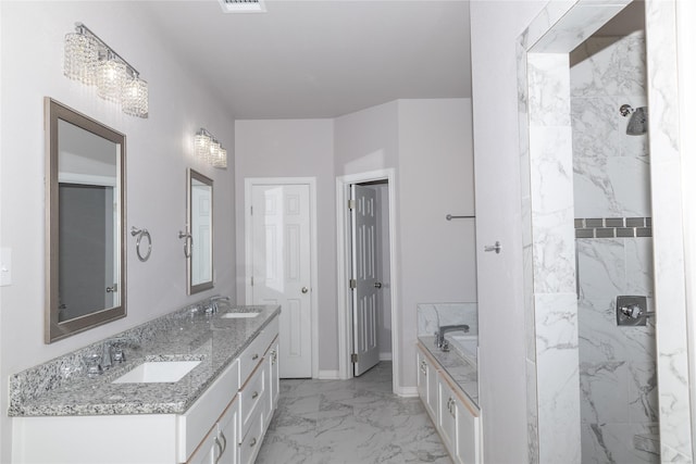 full bath with a garden tub, marble finish floor, double vanity, and a sink