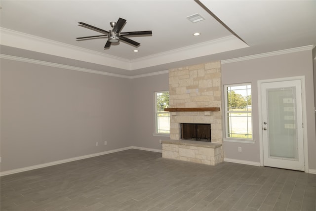 kitchen with light stone countertops, an island with sink, white cabinets, and appliances with stainless steel finishes