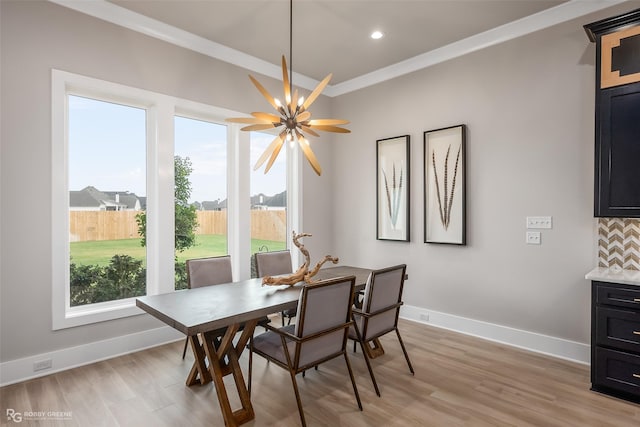642 Caledonia Dr, Bossier City, LA 71111 - dining space featuring baseboards, crown molding, and light wood finished floors
